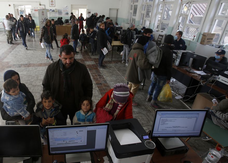 Migrants family wait to register with the police in a refugee center in the southern Serbian town of Presevo, Monday, Nov. 16, 2015. Refugees fleeing war by the tens of thousands fear the Paris attacks could prompt Europe to close its doors, especially after police said a Syrian passport found next to one attacker&amp;#8217;s body suggested its owner passed through Greece into the European Union and on through Macedonia and Serbia last month. (AP Photo/Darko Vojinovic)