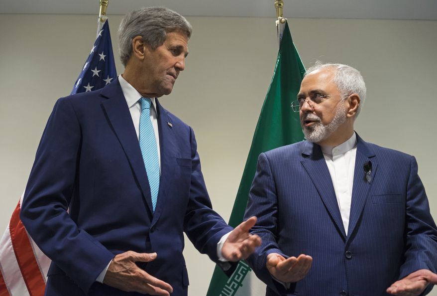 Secretary of State John Kerry (left) meets with Iranian Foreign Minister Mohammad Javad Zarif at United Nations headquarters on Sept. 26, 2015. (Associated Press) **FILE**
