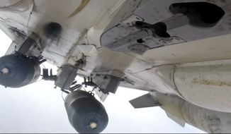 This photo made from footage taken from Russian Defense Ministry official website Tuesday, Nov. 17, 2015, shows a Russian Su-24M during a Russian air raid in Syria. Islamic State militants are barricading down for a possible assault on their de facto capital Raqqa, hiding among civilian homes and preventing anyone from fleeing, as international airstrikes intensify on the Syrian city in the wake of the Paris attacks. For many, the threat of missiles and bombs from the enemies of Islamic State is more of an immediate threat than the vicious oppression of the jihadis&amp;#8217; themselves. (Russian Defense Ministry Press Service via AP)