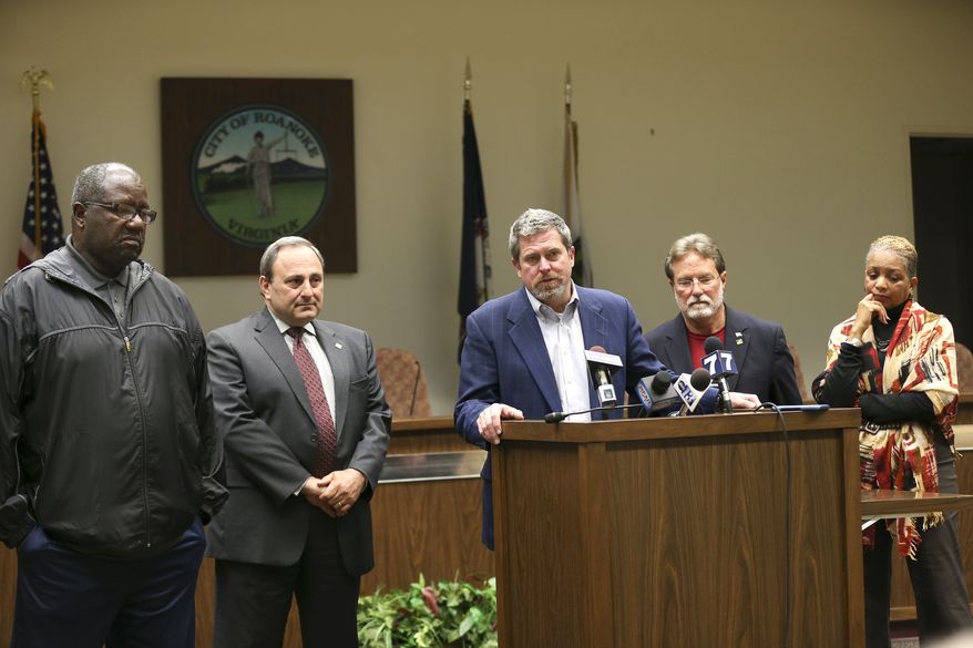 Roanoke, Virginia, Vice Mayor David B. Trinkle (center), joined by council members (from left) Sherman Lea, William D. Bestpitch, Raphael E. Ferris and Anita J. Price, speaks at a news conference Wednesday to denounce comments that Mayor David Bowers made about Syrian refugees. (Associated Press)