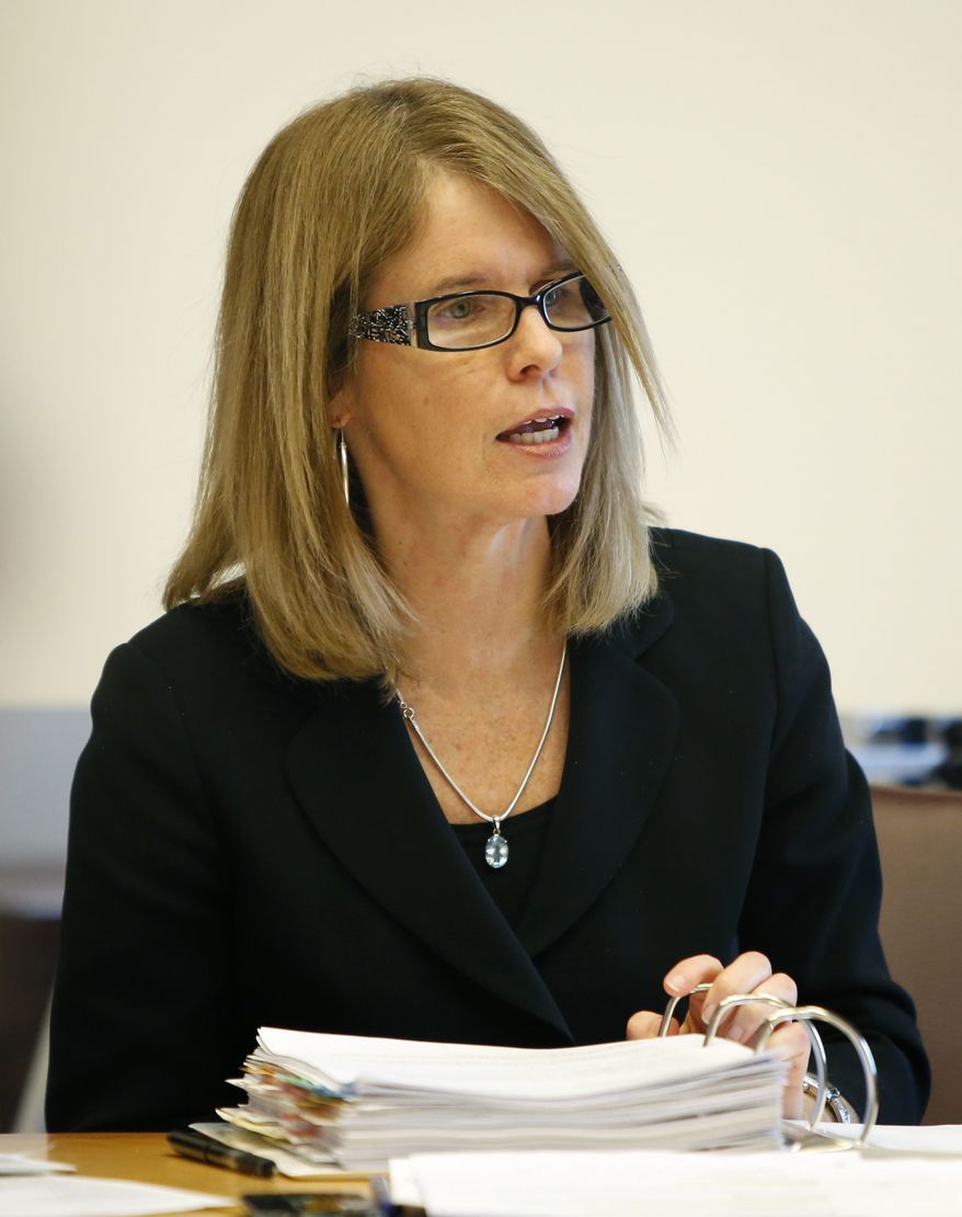 In this Jan. 11, 2013 photo, Mary Mayhew, commissioner of the Maine Department of Health and Human Services, speaks to the Appropriations Committee about details of Gov. Paul LePage's $35.5 million curtailment offer at the State House in Augusta, Maine. (AP Photo/Robert F. Bukaty/File)