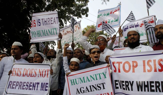 Indian Muslims shout slogans during a protest against ISIS, an Islamic State group, and the Nov. 13 attacks in Paris, in the eastern Indian city of Bhubaneswar, Friday, Nov. 20, 2015. Multiple attacks across Paris last Friday night left 130 dead and many more injured. (AP Photo/Biswaranjan Rout)