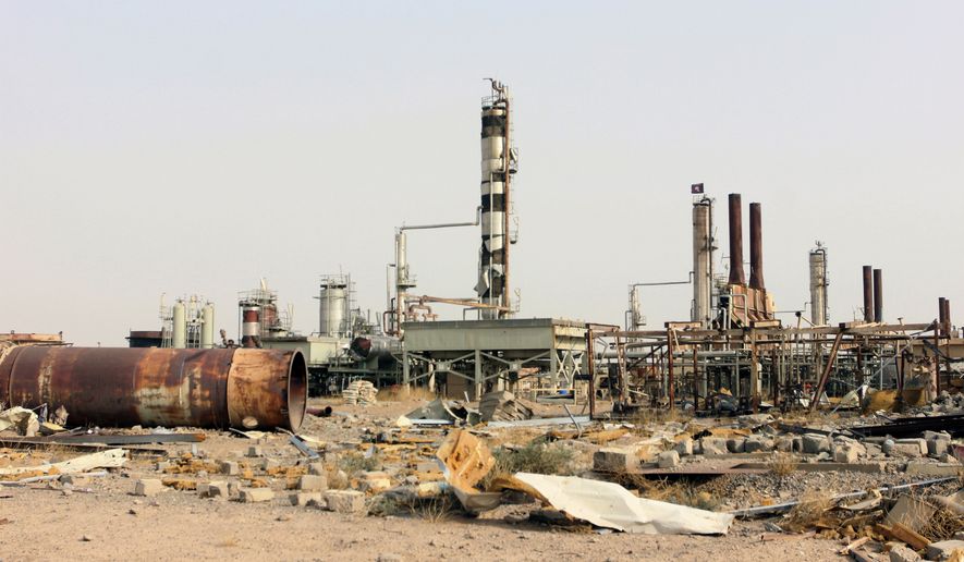This Oct. 22, 2015 file photo shows destruction at Beiji oil refinery during the military operations, some 250 kilometers (155 miles) north of Baghdad, Iraq. The United States and Russia are going after the Islamic State&#39;s oil industry, destroying refineries and hundreds of tanker trucks transporting oil from eastern Syria in a heavy bombardment in recent days aiming to break the extremists&#39; biggest source of income.  (AP Photo/File)