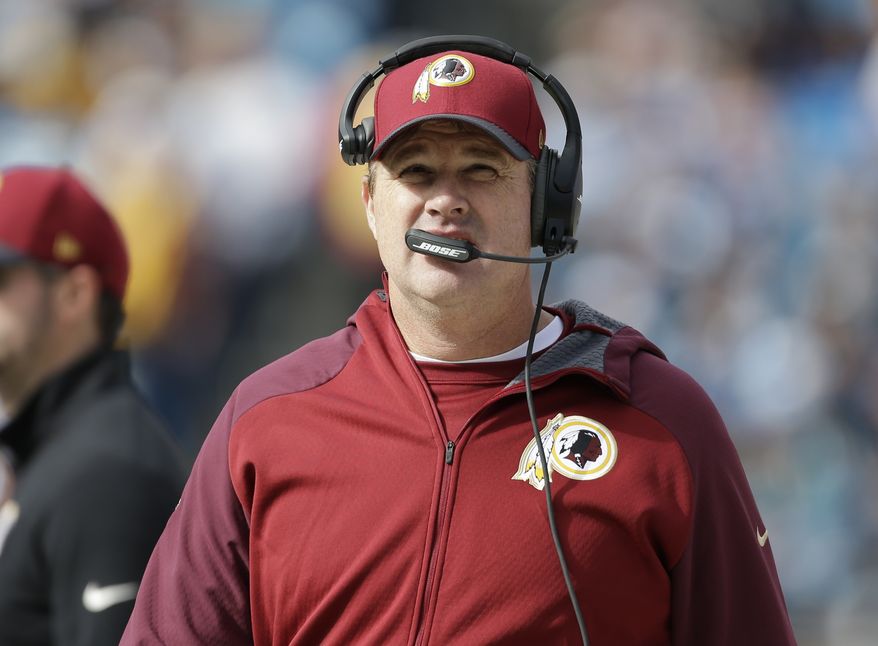 Washington Redskins head coach Jay Gruden watches the action in the first half of an NFL football game against the Carolina Panthers in Charlotte, N.C., Sunday, Nov. 22, 2015. (AP Photo/Bob Leverone)