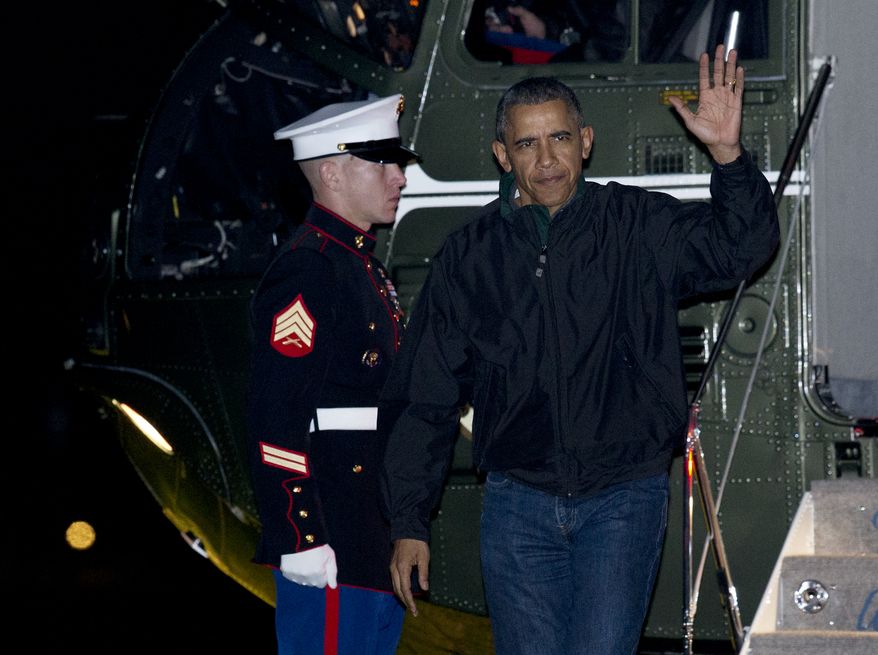 President Barack Obama waves as he arrives at the White House in Washington, Monday, Nov. 23, 2015, from a nine-day trip to Turkey, Philippines and Malaysia. (AP Photo/Manuel Balce Ceneta)
