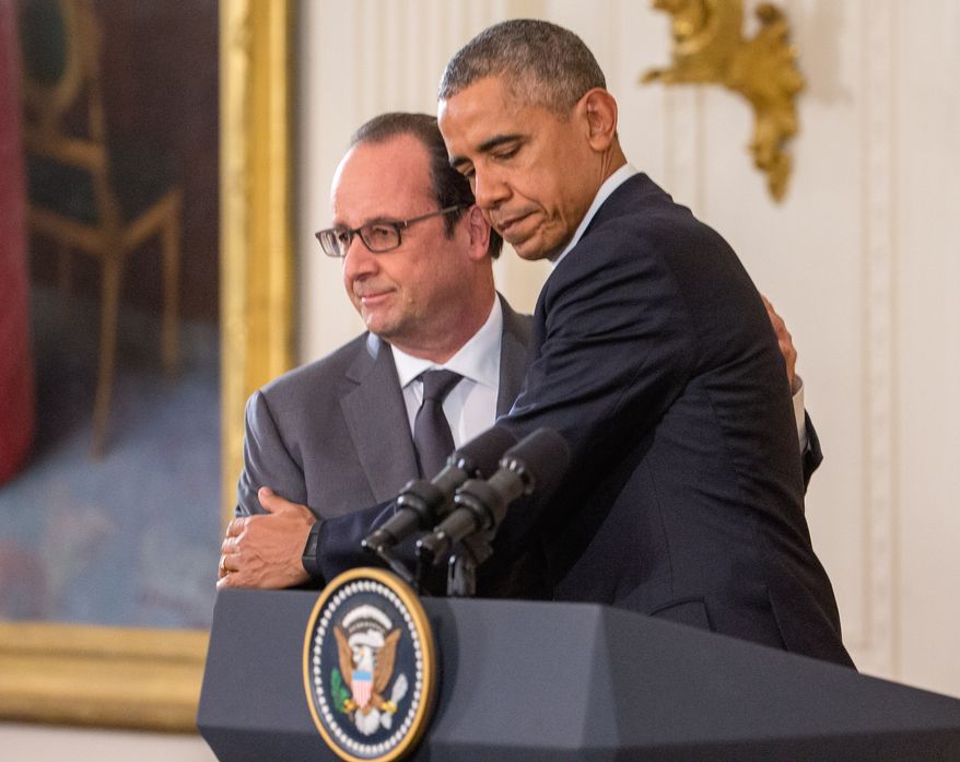 President Barack Obama and French President Francois Hollande embrace during a joint news conference in the East Room of the White House in Washington, Tuesday, Nov. 24, 2015. Hollande&#39;s visit to Washington is part of a diplomatic offensive to get the international community to bolster the campaign against the Islamic State militants. (AP Photo/Andrew Harnik)