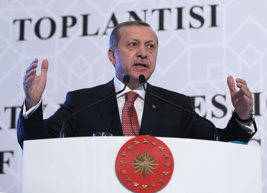 Turkish President Recep Tayyip Erdogan speaks at an Organization of Islamic Cooperation economy meeting in Istanbul, Turkey, Wednesday, Nov. 25, 2015. Erdogan says his country does not wish to escalate tensions with Russia over the downing of its plane. Turkey said the Russian warplane was shot down on Tuesday after it ignored repeated warnings and crossed into its airspace from Syria.(AP Photo/Murat Cetinmuhurdar, Presidential Press Service, Pool )