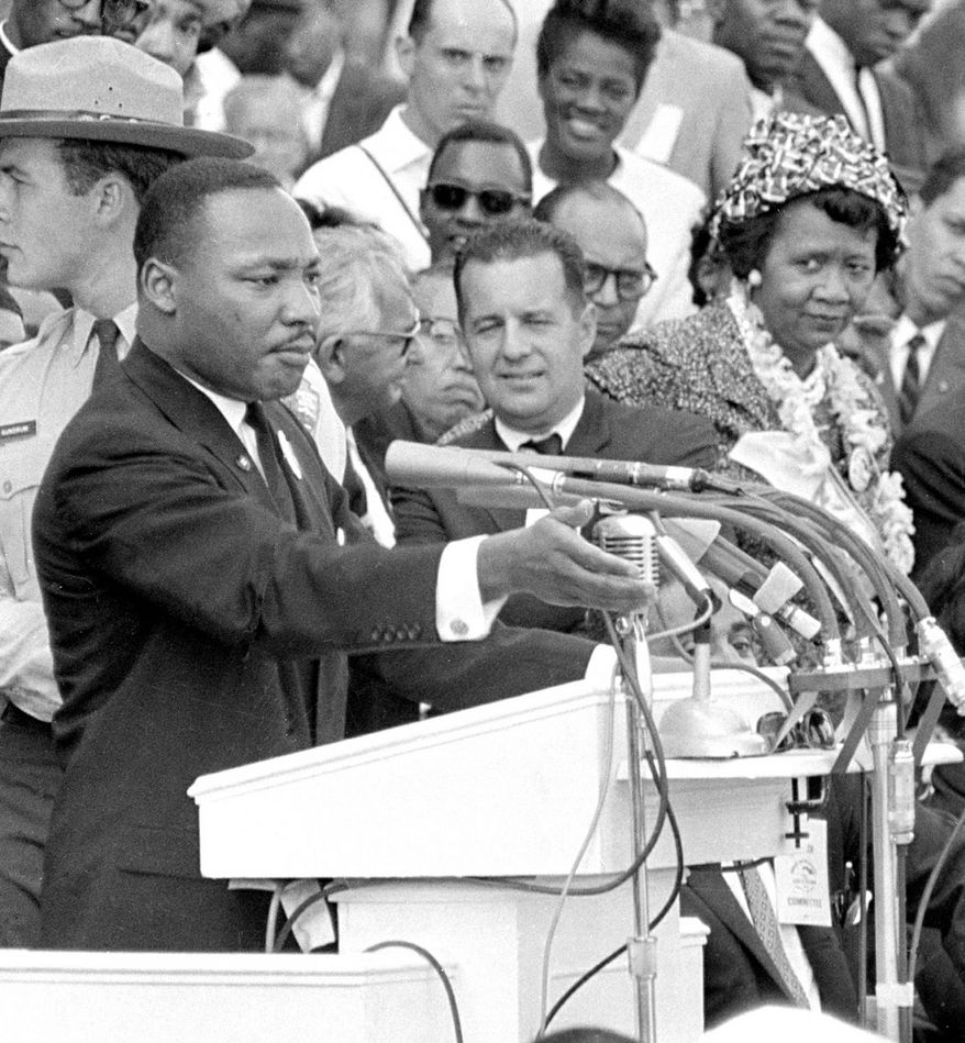 The Rev. Martin Luther King Jr., gestures during his "I Have a Dream" speech as he addresses thousands of civil rights supporters gathered in front of the Lincoln Memorial for the March on Washington for Jobs and Freedom in Washington, D.C., Aug. 28, 1963. (AP Photo)