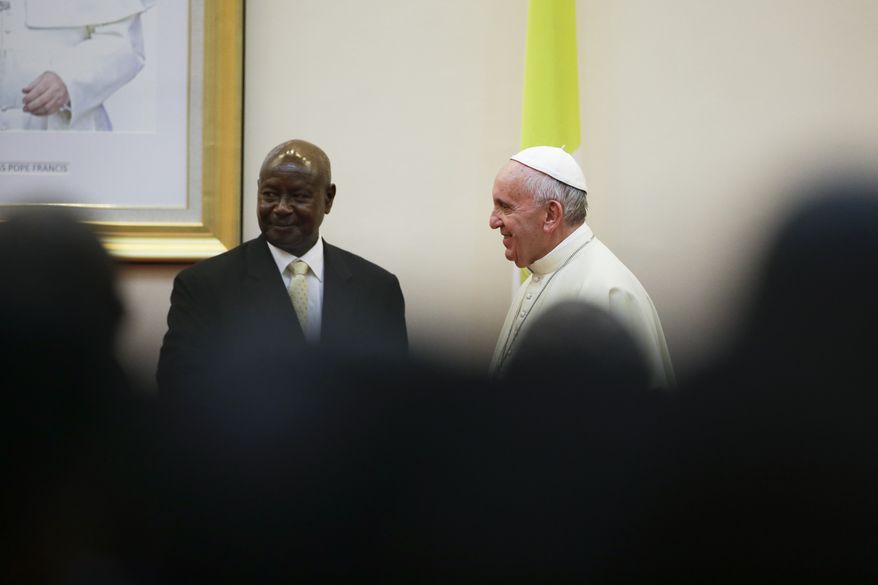 Pope Francis meets with Ugandan President Yoweri Kaguta Museveni at the State House, in Entebbe, Uganda, Friday, Nov. 27, 2015. Pope Francis is in Africa for a six-day visit that is taking him to Kenya, Uganda and the Central African Republic. (AP Photo/Andrew Medichini)