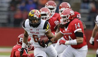 Maryland running back Ty Johnson (6) breaks tackles as he runs for yardage during the second half of an NCAA college football game against Rutgers Saturday, Nov. 28, 2015, in Piscataway, N.J. Maryland won 46-41. (AP Photo/Mel Evans)