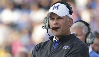 ﻿﻿Memphis head coach Justin Fuente watches during the first half of an NCAA college football game against Kansas Saturday, Sept. 12, 2015, in Lawrence, Kan. (AP Photo/Charlie Riedel)