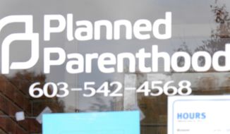 Planned Parenthood in Claremont, N.H., closes its doors on Oct. 21, 2015, as employees and professional cleaners responded to damage left by a vandal. (Associated Press) **FILE**