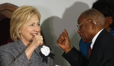 Democratic presidential candidate Hillary Clinton greets and gives a thumbs-up to Fred Gray, Rosa Parks former attorney, before speaking at the Dexter Avenue King Memorial Baptist Church, Tuesday, Dec. 1, 2015, in Montgomery, Ala. (AP Photo/ Hal Yeager) ** FILE **