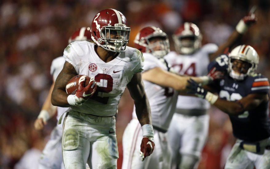 FILE - In this Nov. 28, 2015, file photo, Alabama running back Derrick Henry (2) runs the ball and scores a touchdown during the second half of an NCAA college football game against Auburn in Auburn, Ala. No. 2 Alabama's offensive methods have changed but the priority remains the same: Get the ball to the Crimson Tide's best player. Last year, that was Amari Cooper; now, clearly, it is Henry. (AP Photo/Gerald Herbert, File)