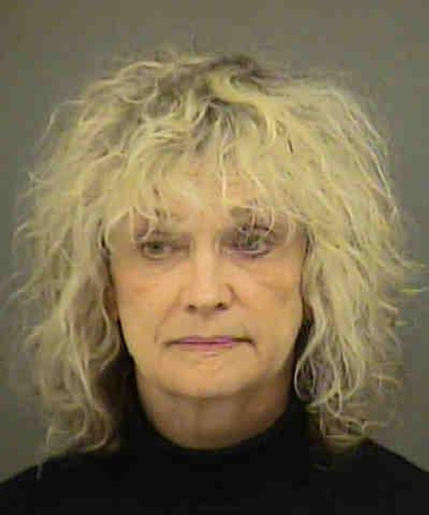 This booking photo provided by the Mecklenburg County Sheriff's Office shows Joanne Snow. Snow, an American Airlines flight attendant accused of attacking fellow crew members and two U.S. air marshals during a trans-Atlantic flight, made her first court appearance on Tuesday, Dec. 1, 2015, where attorneys argued over whether she should be held in custody or released to her family. (Mecklenburg County Sheriff's Office via AP)