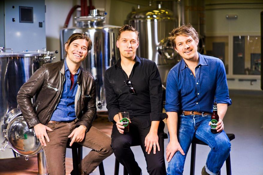 In this photo taken on April 16, 2014, provided by Hanson Brothers Beer, from left to right, brothers Zac Hanson, Isaac Hanson and Taylor Hanson pose for a photo at Oklahoma City Brewing Company, in Oklahoma City. In 18 years the trio went from belting out "MMMBop" to brewing their own Mmmhops beer. (Matthew Swaggart/Hanson Brothers Beer via AP)