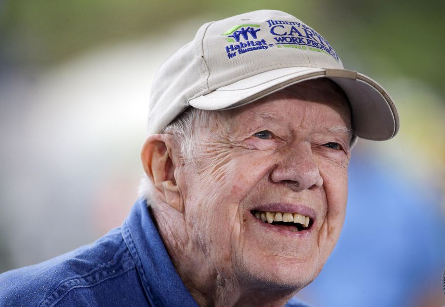FILE - In a Monday, Nov. 2, 2015 file photo, former President Jimmy Carter answers questions during a news conference at a Habitat for Humanity building site, in Memphis, Tenn. Jimmy Carter's grandson Jason Carter said Wednesday, Dec. 2, 2015, the 91-year-old former president is doing well while undergoing cancer treatment and showing no sign of slowing down, despite his pledge to do just that. (AP Photo/Mark Humphrey, File)