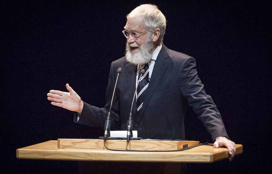 David Letterman returned to Ball State's campus in Muncie, Ind., Monday, Nov, 30, 2015, to hold a talk with filmmakers Spike Jonze and Bennett Miller in front of a packed Emens Auditorium. Letterman is donating memorabilia from his career in television to his alma mater. (Corey Ohlenkamp/The Star Press via AP)