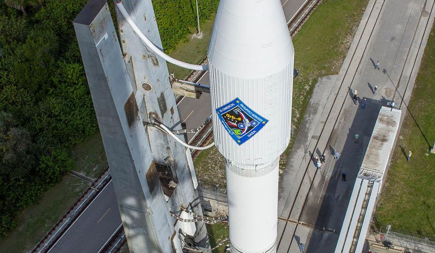 In this photo provided by the United Launch Alliance, an Atlas V rocket carrying the Orbital ATK Cygnus spacecraft, is rolled from the Vertical Integration Facility to a launch pad at the Cape Canaveral Air Force Station in Cape Canaveral, Fla., on Wednesday, Dec. 2, 2015. Orbital&#39;s Antares rocket is still grounded following a 2014 launch explosion that damaged a Virginia launch pad. (United Launch Alliance via AP)