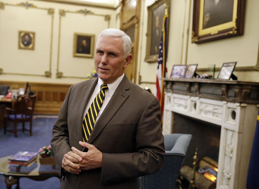 Indiana Gov. Mike Pence speaks after a meeting with Indianapolis Archbishop Joseph Tobin at the Statehouse Wednesday, Dec. 2, 2015, in Indianapolis, a day after the archdiocese said it has the means to resettle a Syrian refugee family bound for the state. Pence blocked state agencies from distributing federal money for Syrian refugees following the deadly Paris attacks. (AP Photo/Darron Cummings)
