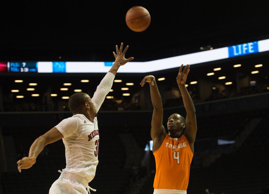 Tennessee guard Robert Hubbs III (3) takes a shot over Nebraska forward Ed Morrow (30) during the first half of an NCAA college basketball game in the consolation game at the Barclays Center Classic. Saturday, Nov. 28, 2015, in New York. (AP Photo/Bryan R. Smith)