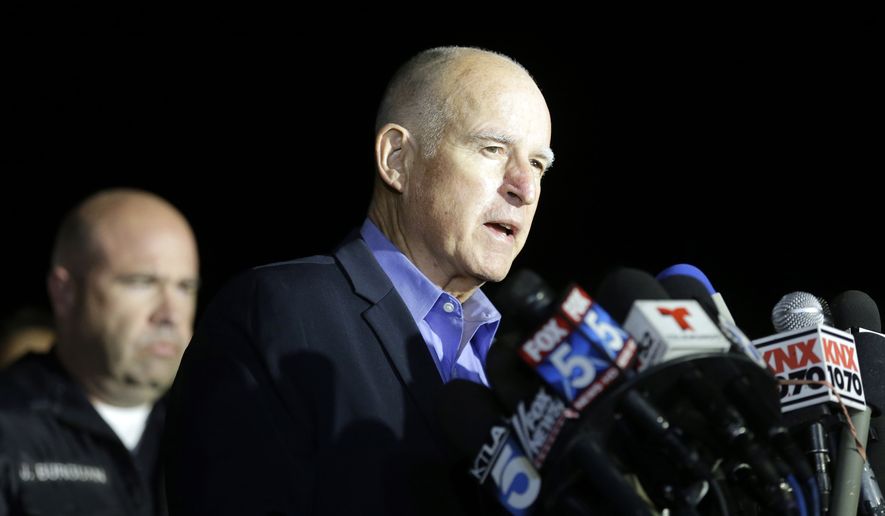 California Gov. Jerry Brown reacts as he speaks during a press conference near the site of yesterday&#39;s mass shooting on Thursday, Dec. 3, 2015 in San Bernardino, Calif. A husband and wife on Wednesday, dressed for battle and carrying assault rifles and handguns, opened fire on a holiday banquet for his co-workers, killing at least 14 people and seriously wounding more than a dozen others in a precision assault, authorities said. Hours later, the couple died in a shootout with police. (AP Photo/Chris Carlson)