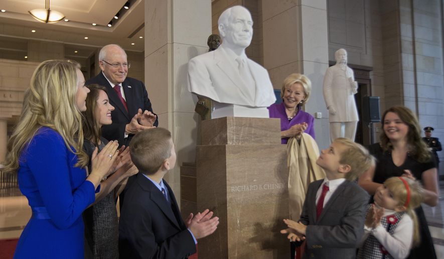 Former Vice President Dick Cheney, back left, his wife Lynne Cheney, back right, and their grandchildren applaud as his marble bust is unveiled in the Emancipation Hall on Capitol Hill in Washington, Thursday, Dec. 3, 2015. Congressional leaders and former President George W. Bush paid tribute to Cheney, who also served as congressman from Wyoming. (AP Photo/Manuel Balce Ceneta)