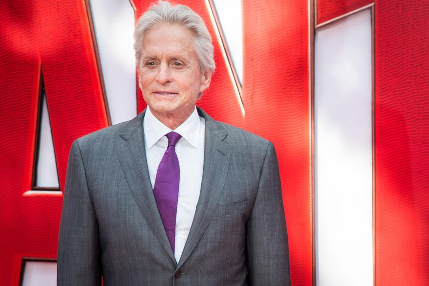FILE - In this July 8, 2015 file photo, Michael Douglas poses for photographers upon arrival at the premiere of the film "Ant Man," in London. An emotional Douglas said surviving his cancer scare several years ago gave him new vitality as he settles into his senior years. Douglas, 71, spoke about his health at an AARP luncheon on Thursday, Dec. 3, 2015, celebrating the Academy Award-winner’s storied career and said: “It’s good to be alive.” (Photo by Vianney Le Caer/Invision/AP, File)