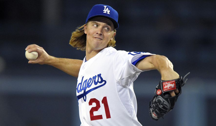 File - In this Sept. 18, 2015, file photo, Los Angeles Dodgers starting pitcher Zack Greinke throws to the plate during the first inning of a baseball game against the Pittsburgh Pirates in Los Angeles. A person with knowledge of the deal tells The Associated Press that free agent Greinke and the Arizona Diamondbacks have reached agreement on a six-year contract. The person spoke to the AP on condition of anonymity Friday night, Dec.4, 2015, because there had not been an official announcement. (AP Photo/Mark J. Terrill, File)