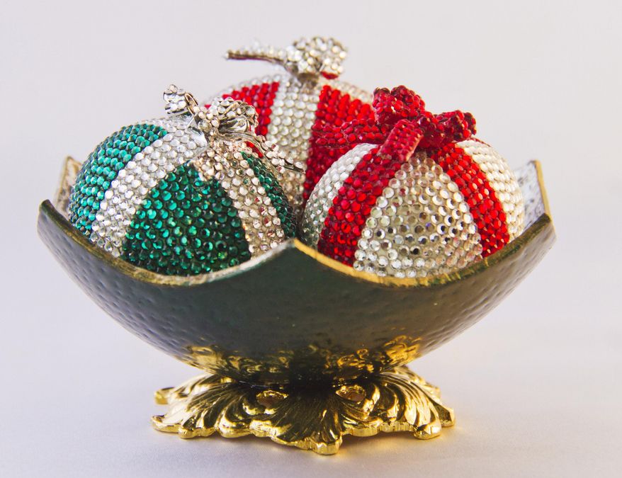** ADVANCE FOR WEEKEND DEC. 5-6, 2015 AND THEREAFTER ** In this Oct. 23, 2015 photo, Christmas themed Faberge style eggs are seen in the studio of Eileen Tokita at her home in Honolulu, Hawaii. Tokita said she has decorated more than 1,500 eggs, each one unique, over the span of 40 years. (Dennis Oda/Honolulu Star-Advertiser via AP)