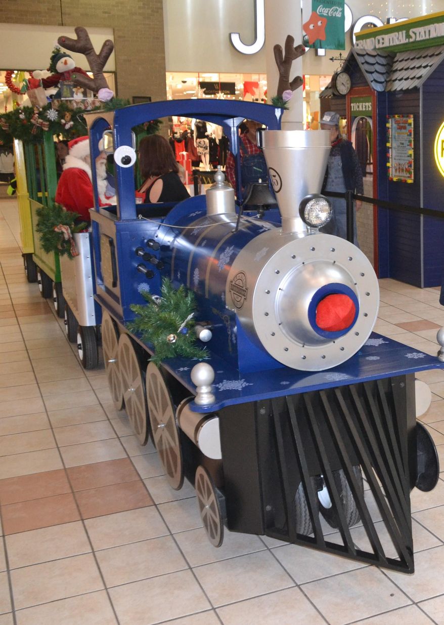 ADVANCE FOR SUNDAY DEC. 6 AND THEREAFTER - This Monday Nov. 11, 2015 photo shows the Grand Central Express, the trackless train that takes guests on a ride around the Grand Central Mall in Vienna, W.Va. (Brett Dunlap/Parkersburg News and Sentinel via AP)