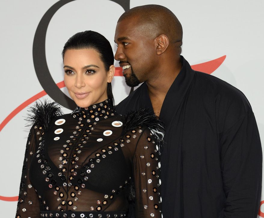 FILE - In this Monday, June 1, 2015, file photo, Kim Kardashian, left, and Kanye West arrive at the 2015 CFDA Fashion Awards at Alice Tully Hall, Lincoln Center, in New York. Kim Kardashian West and husband Kanye West welcomed a baby boy early Saturday, Dec. 5, 2015, in Los Angeles. This is the second child for the superstar couple: Daughter North was born in 2013. (Photo by Evan Agostini/Invision/AP, File)