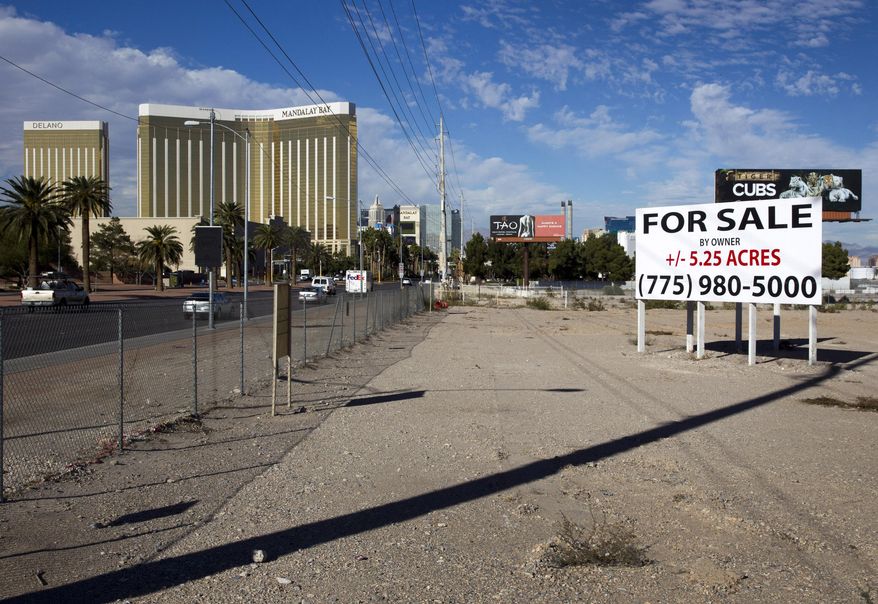This Monday, Nov. 23, 2015 photo shows a sign of land for sale in the south Strip of Las Vegas Boulevard. Development in the south Strip likely will happen "at some point," but for now, investors are largely concentrating on the north Strip, said real estate broker John Knott, an executive vice president with CBRE Group and head of its global gaming group. (Steve Marcus/Las Vegas Sun via AP) MANDATORY CREDIT