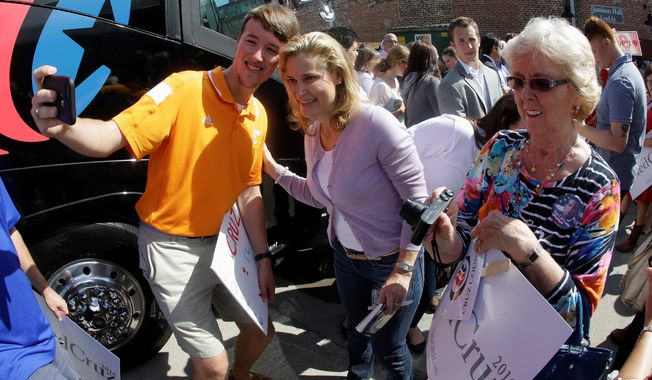 Heidi Cruz (center), wife of Republican presidential candidate Sen. Ted Cruz, has been a powerful and crucial behind-the-scenes asset for her husband&#x27;s campaign, often putting in 18-hour days. (Associated Press)
