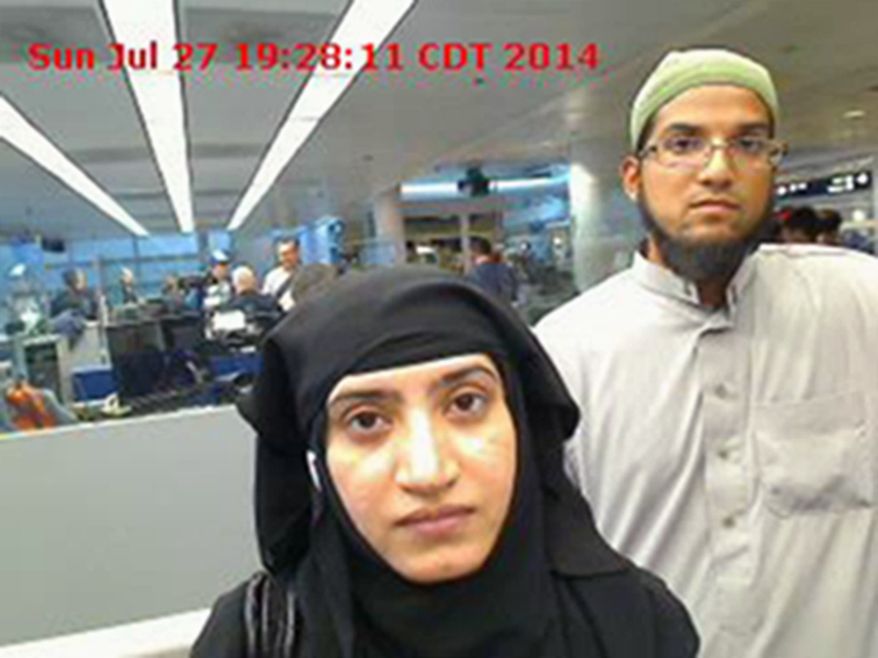 This July 27, 2014 photo provided by U.S. Customs and Border Protection shows Tashfeen Malik and Syed Farook as they passed through O&#39;Hare International Airport in Chicago. (U.S. Customs and Border Protection via Associated Press)
