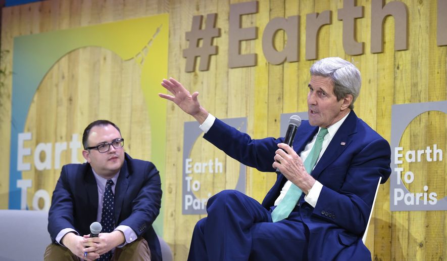 US Secretary of State John Kerry, right, gestures as he speaks, flanked by Mashable science editor Andrew Freedman, at the Mashable/UN Foundation &quot;Earth to Paris&quot; summit at Le Petit Palais in Paris, France, on the sidelines of the COP21, the UN climate change conference, Monday, Dec. 7, 2015. (Mandel Ngan/Pool Photo via AP)