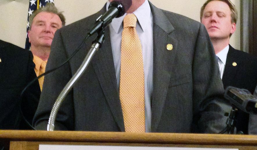FILE - In a Nov. 6, 2014 file photo, Speaker Rep. Kevin Cotter, R-Mount Pleasant, speaks at the Michigan Capitol in Lansing, Mich. Two former legislative aides have sued the Michigan House of Representatives, alleging wrongful termination after reporting lawmakers' extramarital affair and other wrongdoing to Speaker Cotter's office. In the federal lawsuit filed Monday, Dec. 7, 2015, Keith Allard and Ben Graham say Cotter's then-chief of staff and a top House lawyer knew their firings were retaliation. (AP Photo/David Eggert, FILE)