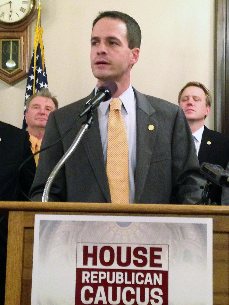 FILE - In a Nov. 6, 2014 file photo, Speaker Rep. Kevin Cotter, R-Mount Pleasant, speaks at the Michigan Capitol in Lansing, Mich. Two former legislative aides have sued the Michigan House of Representatives, alleging wrongful termination after reporting lawmakers' extramarital affair and other wrongdoing to Speaker Cotter's office. In the federal lawsuit filed Monday, Dec. 7, 2015, Keith Allard and Ben Graham say Cotter's then-chief of staff and a top House lawyer knew their firings were retaliation. (AP Photo/David Eggert, FILE)