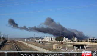 This image posted online Sunday, Dec. 6, 2015, by supporters of the Islamic State militant group on an anonymous photo sharing website, shows smoke rising in the aftermath of an airstrike that targeted areas in Raqqa, Syria. The photo bears the watermark of Islamic State media releases and is consistent with other AP reporting. The Arabic caption on the photo reads, &amp;quot;Russian warplanes target homes of Muslims in Raqqa.” (militant photo via AP) ** FILE **