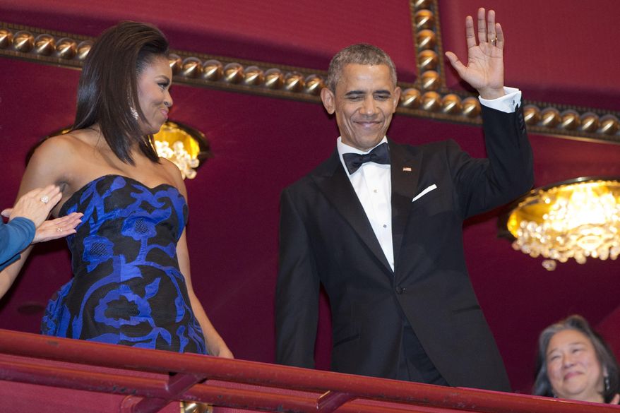 President Barack Obama, with first lady Michelle Obama, waves as they arrive at the 2015 Kennedy Center Honors in Washington, after the President made an address to the nation, Sunday, Dec. 6, 2015. (AP Photo/Jacquelyn Martin)