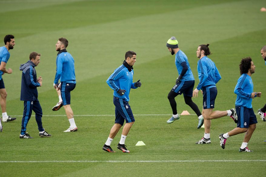 Real Madrid's Cristiano Ronaldo, center, runs with teammates during a training session in Valdebebas stadium in Madrid, Spain, Monday, Dec. 7, 2015. Real Madrid will face Malmo FF in a Champion's League Group A soccer match on Tuesday. (AP Photo/Daniel Ochoa de Olza)