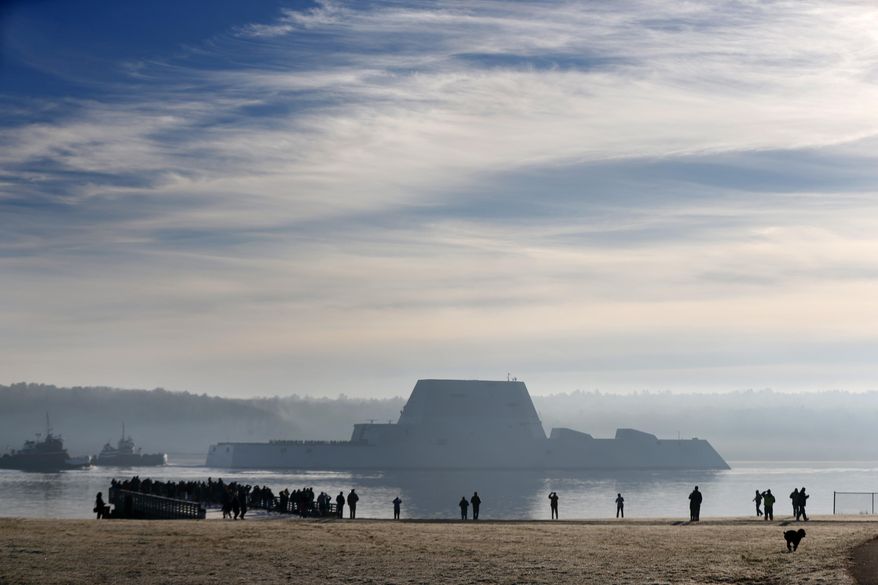 The first Zumwalt-class destroyer, the largest ever built for the U.S. Navy, heads down the Kennebec River after leaving Bath Iron Works, Monday, Dec. 7, 2015, in Bath, Maine. The ship is headed out to sea for the first time to undergo sea trials.(AP Photo/Robert F. Bukaty)
