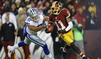 Washington Redskins wide receiver DeSean Jackson (11) carries the ball on a kickoff return under pressure from Dallas Cowboys outside linebacker Kyle Wilber (51) during the second half of an NFL football game in Landover, Md., Monday, Dec. 7, 2015. Jackson later fumbled the play on the play. The Cowboys defeated the Redskins 19-16. (AP Photo/Patrick Semansky)