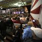 An overflow crowed fills the hangar deck of the USS Yorktown as Republican presidential candidate, businessman Donald Trump, speaks during a rally coinciding with Pearl Harbor Day at Patriots Point aboard the aircraft carrier USS Yorktown in Mt. Pleasant, S.C., Monday, Dec. 7, 2015. (AP Photo/Mic Smith)