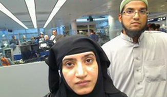 This July 27, 2014 photo provided by U.S. Customs and Border Protection shows Tashfeen Malik, left, and Syed Farook, as they passed through O&#x27;Hare International Airport in Chicago. The husband and wife died on Dec. 2, 2015, in a gun battle with authorities several hours after their assault on a gathering of Farook&#x27;s colleagues in San Bernardino, Calif. (U.S. Customs and Border Protection via AP, File)