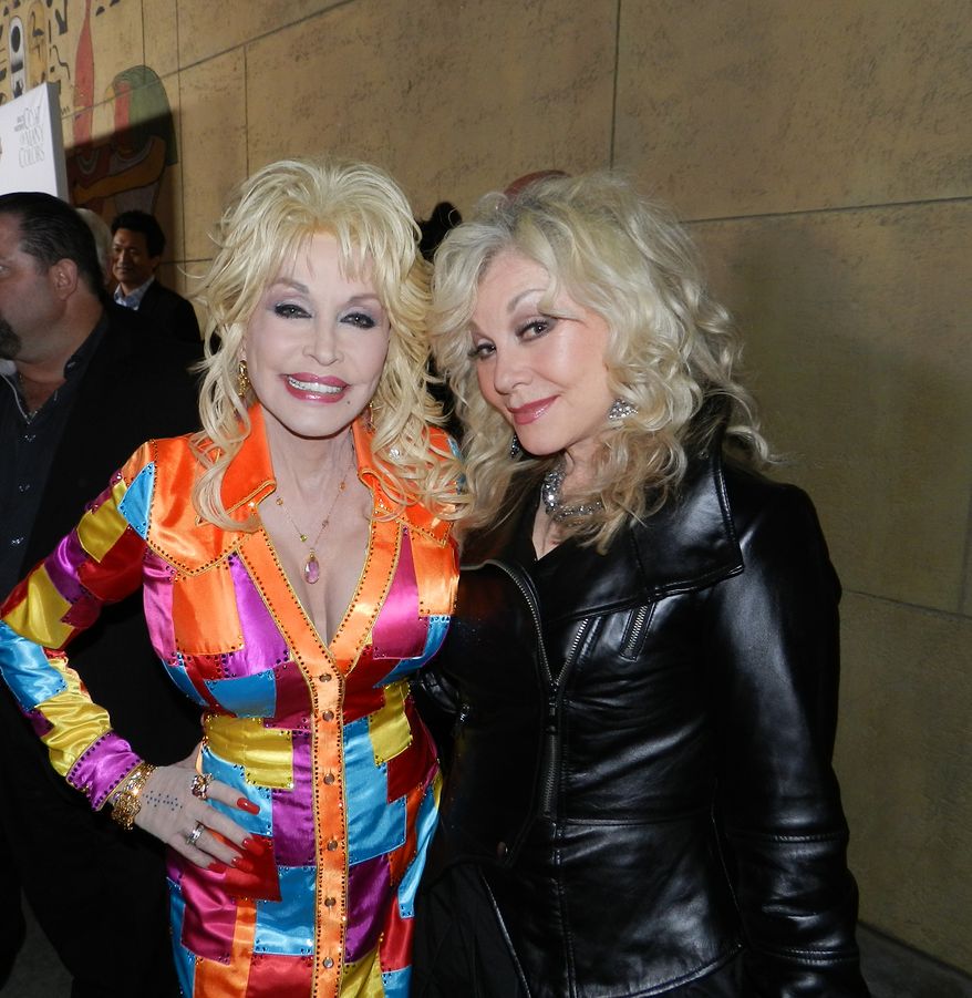 Dolly Parton, left, and sister Stellar Parton, right, at the premiere of &quot;Coat of Many Colors&quot; in Los Angeles. (Dave Kapp)