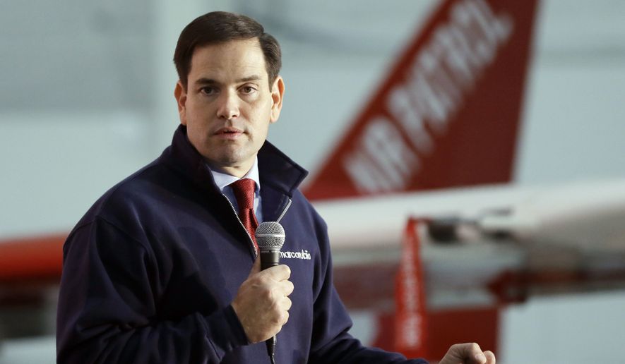 Republican presidential candidate, Sen. Marco Rubio, R-Fla., addresses supporters at the Oakland County International Airport, Wednesday, Dec. 9, 2015, in Waterford Township, Mich. (AP Photo/Carlos Osorio)