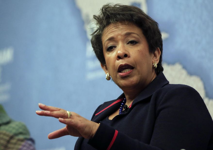 U.S. Attorney General Loretta Lynch gestures as she answers a question from the audience after speaking at Chatham House, The Royal Institute for International Affairs, in London, Wednesday, Dec. 9, 2015. (AP Photo/Alastair Grant) ** FILE **