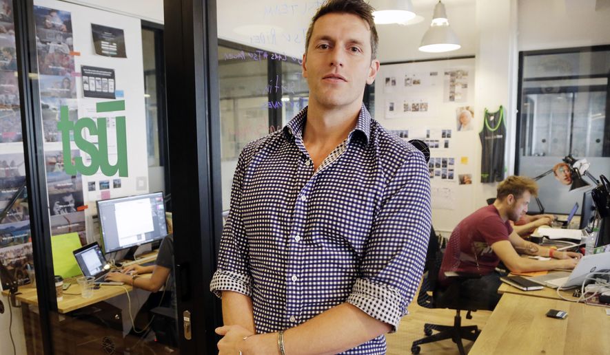 FILE - In this Wednesday, Nov. 4, 2015 file photo, Sebastian Sobczak, CEO of Tsu.co, poses for a photo in his company's New York office. On Tuesday, Facebook lifted a ban that blocked material from Tsu.co, a small rival challenging the world's largest social network's financial dependence on free content shared by its 1.5 billion users. (AP Photo/Mark Lennihan)