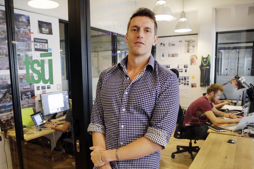 FILE - In this Wednesday, Nov. 4, 2015 file photo, Sebastian Sobczak, CEO of Tsu.co, poses for a photo in his company's New York office. On Tuesday, Facebook lifted a ban that blocked material from Tsu.co, a small rival challenging the world's largest social network's financial dependence on free content shared by its 1.5 billion users. (AP Photo/Mark Lennihan)